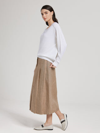 White long-sleeve V-neck knit top with beaded neckline detail