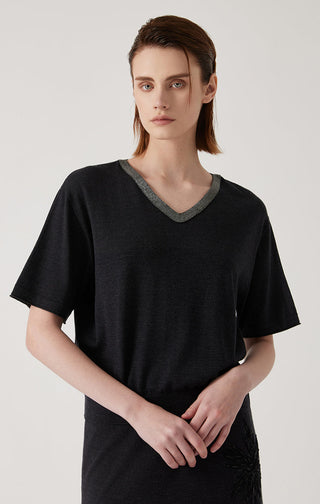 Black V-neck knit top with gray-trimmed neckline and short sleeves