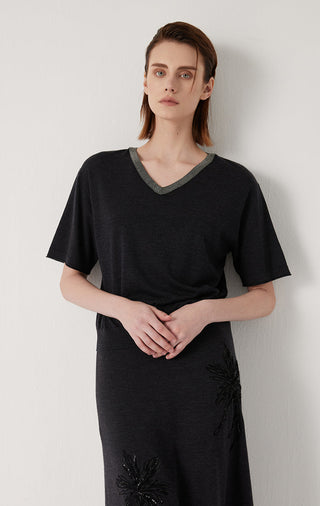 Black knit top with V-neck and gray trim; short sleeves, relaxed drape