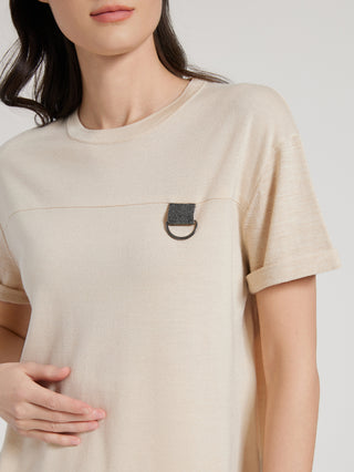 Close-up of camel knit T-shirt chest beaded ring detail on front panel