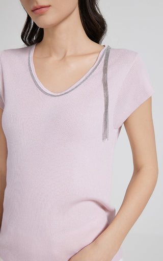 Pink V-neck knit top with beaded neckline tassel and ribbed trim, short sleeves