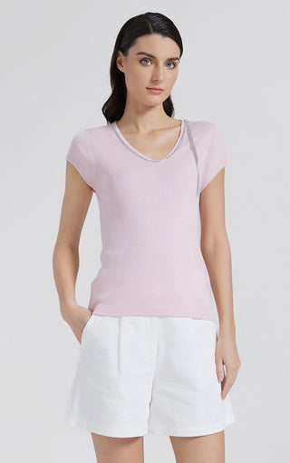 Pink ribbed knit top with V-neck and beaded trim at neckline, short sleeves