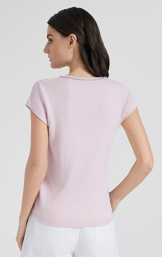 Back view of pink ribbed knit top, short sleeves and curved hem