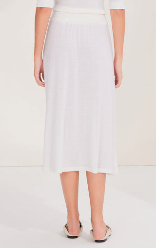 White wool midi skirt, back view with smooth pleats and elastic waistband