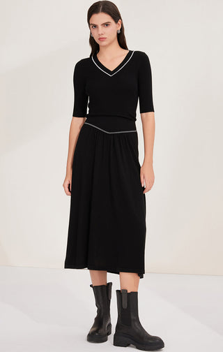 Black wool midi skirt with beaded chain trim waistband, gathered and full mid-calf length
