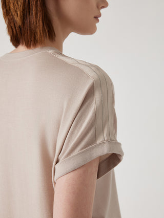 Camel knit top shoulder with decorative bead trim and stitched seam detail