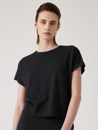 Black relaxed knit top with crew neckline and short sleeves