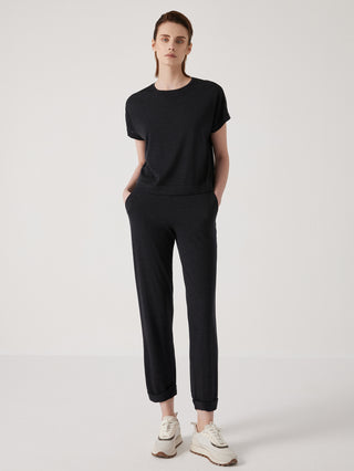 Black wool-silk knit top with beaded shoulder detail, crew neck and short sleeves.