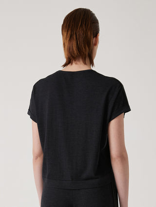 Black knit top back view with relaxed crew neck and short sleeves