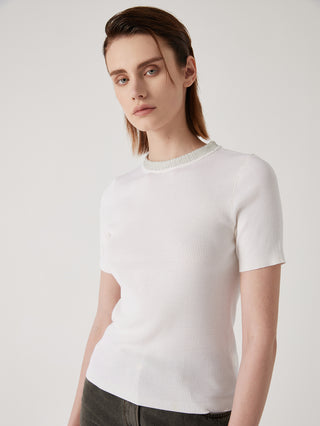 White wool-silk knit top with crew neck ribbing and short sleeves, angled view