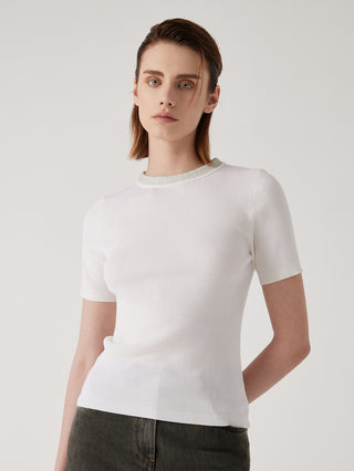 White wool-silk knit top, short sleeves and crew neck, side/front close view