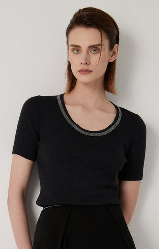 Black ribbed knit top close-up with contrasting ribbed scoop neckline trim