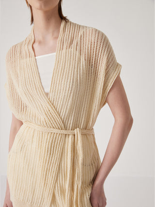 Apricot linen wrap cardigan close-up: open V-neck, knit texture, tie belt at waist