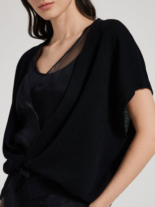 Black batwing sleeve top with V-neck and textured fabric, front tie at waist