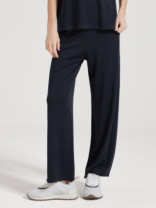 Dark gray wide-leg knit pants with elastic waist and straight drape, side view