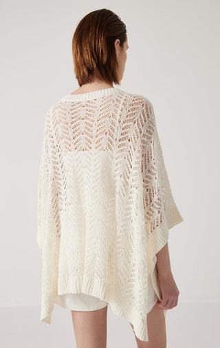 White openwork sequin-trim linen knit pullover, loose poncho-like back and ribbed hem