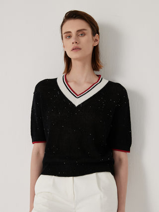Black ribbed knit V-neck knit top with sequin speckles and striped trim; short sleeves