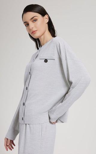 Light gray wool silk knit cardigan with long sleeves and button front, side view
