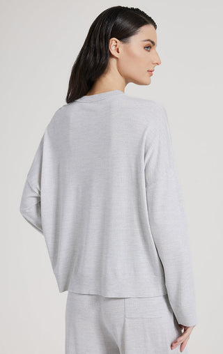 Light gray wool silk knit cardigan, long sleeves, clean back view, button placket