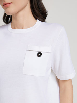 Close-up: white short-sleeve T-shirt with chest pocket and black button