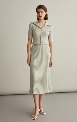 Ivory white knit top with short sleeves, ribbed texture, and half-zip mock neck
