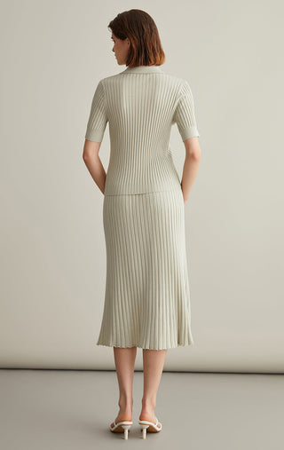 Ivory white wool-silk knit top with short sleeves and ribbed bodice, half-zip neckline