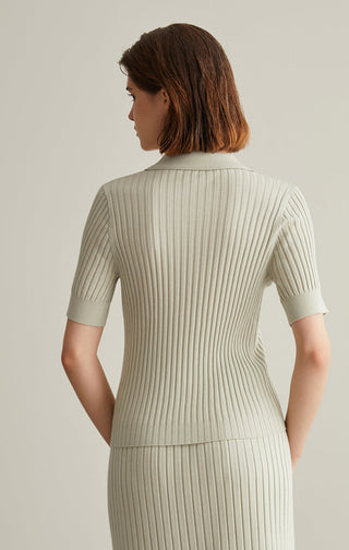 Back view of ivory white ribbed knit top with short sleeves and half-zip mock neck