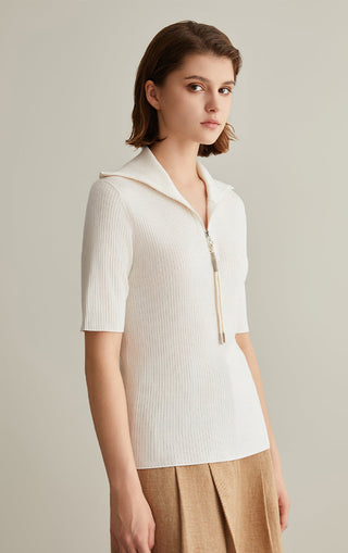 Ivory white wool-silk knit top with short sleeves, half-zip mock neck, and ribbed texture