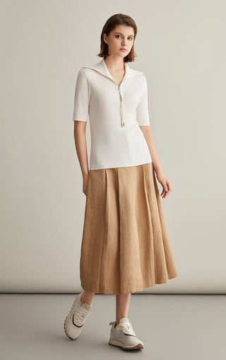 Ivory wool-silk knit top with zipped mock neck, short sleeves, ribbed texture