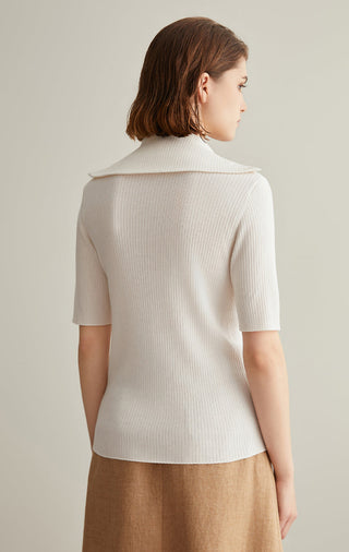 Back view of ivory white ribbed knit top with half-zip mock neck and short sleeves