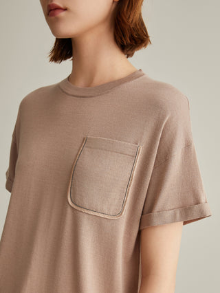 Close-up: khaki short-sleeve T-shirt with front patch pocket and contrast-edged trim