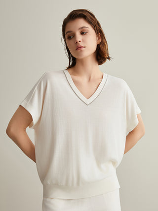 White silk-wool V-neck top with short sleeves and ribbed waist band