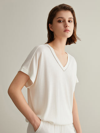 White V-neck silk-wool top with short sleeves and smooth neckline facing