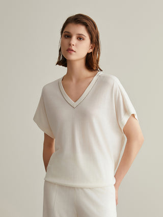 White silk-wool V-neck top with subtle beaded neckline, short sleeves