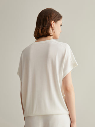 White V-neck silk-wool top from back with short sleeves and banded hem
