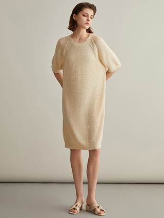 Beige knit shift dress with beaded neckline detail, elbow-length sleeves