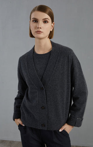 Dark gray cashmere V-neck button cardigan with long sleeves and ribbed hem detail