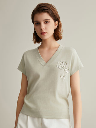 Light green wool-silk knit top with V-neck; short sleeves and right-chest floral embroidery