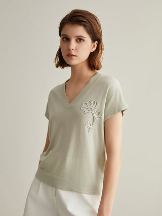 Light green wool-silk knit top with V-neck and right-chest white floral embroidery, short sleeves