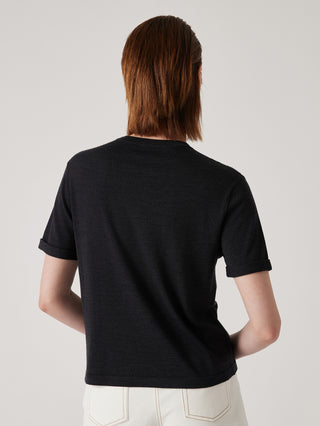 Black wool-silk textured knit top, short sleeves, crew neck; back view