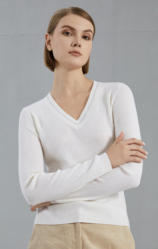 White ribbed knit V-neck sweater top, long sleeves, close front view