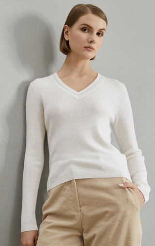 White fine wool V-neck pullover, front view with ribbed hem and long sleeves