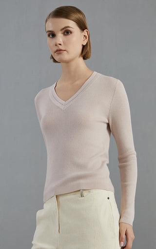 Apricot ribbed wool V-neck knit top with long sleeves and fitted silhouette
