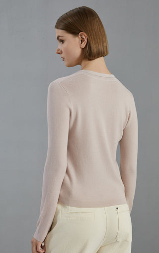 Apricot ribbed V-neck knit top, back view with long sleeves
