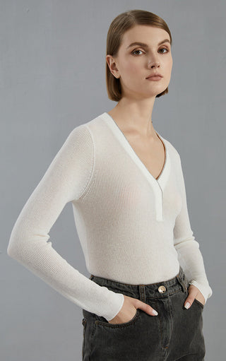White V-neck sweater in fine knit with long sleeves; half-zip placket detail