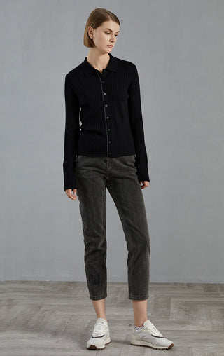 Black ribbed knit cardigan with button-front and collar; full-body side view