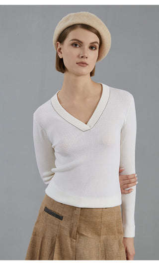 White wool V-neck knit top with long sleeves and subtle ribbed texture