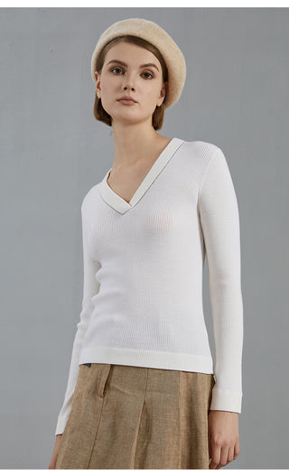 White V-neck wool knit top with ribbed neckline and long sleeve cuffs