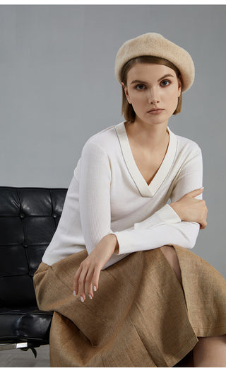 White wool V-neck knit top with long sleeves and ribbed V-neck collar