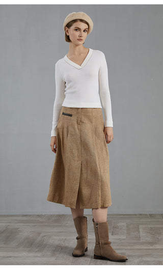 White wool V-neck knit top with long sleeves and ribbed cuffs